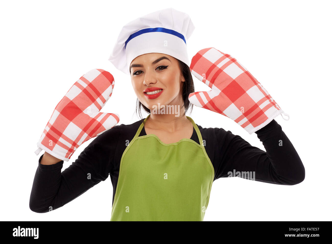 Beautiful latino cook wearing a pair of oven gloves, isolated on white background Stock Photo