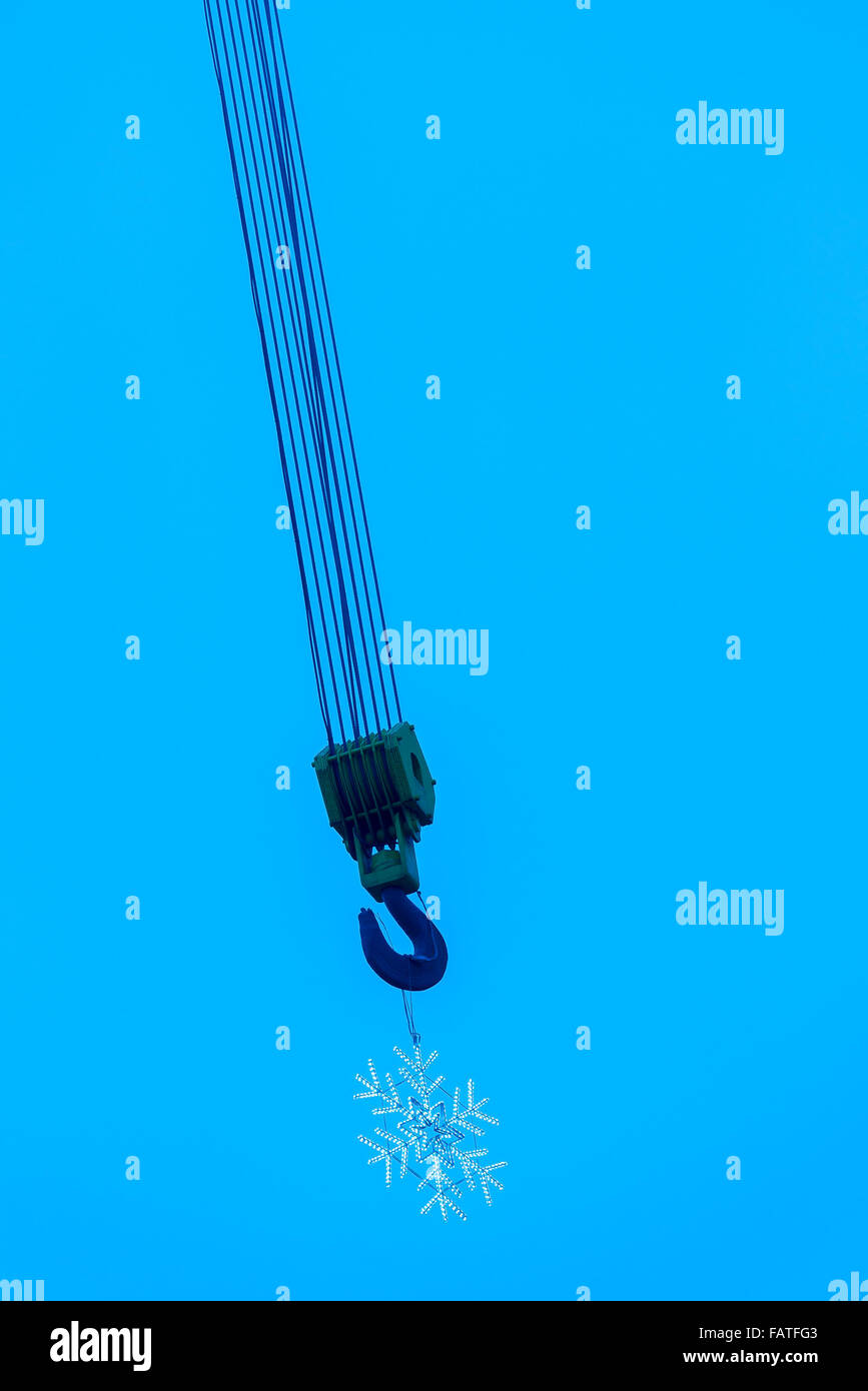 Crane hook with snowflake decoration. Stock Photo