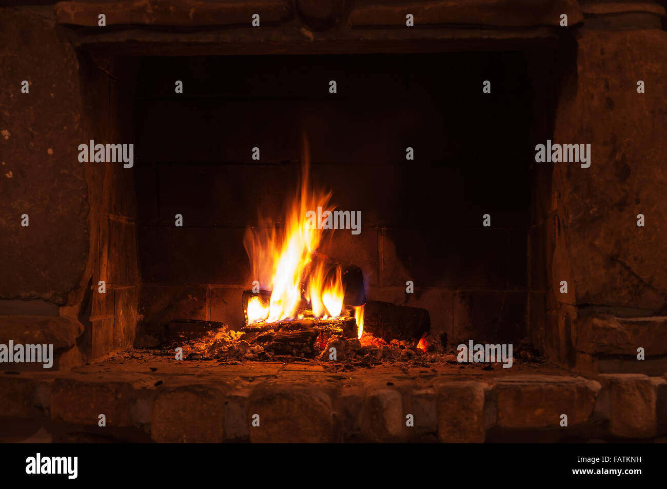 Comfortable log fire fireplace flame wood burning home interior heat