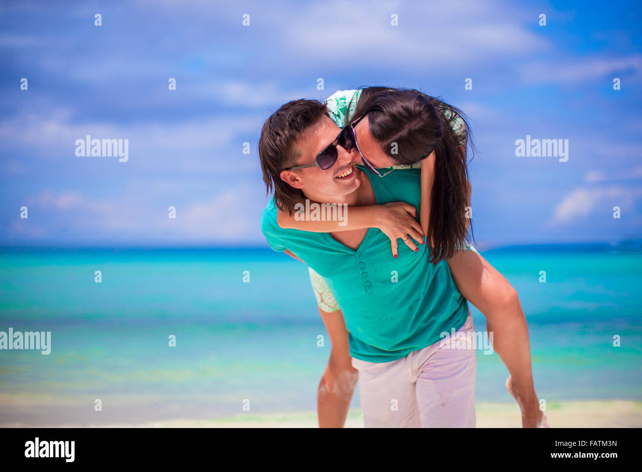 Young happy couple have fun during beach vacation Stock Photo - Alamy
