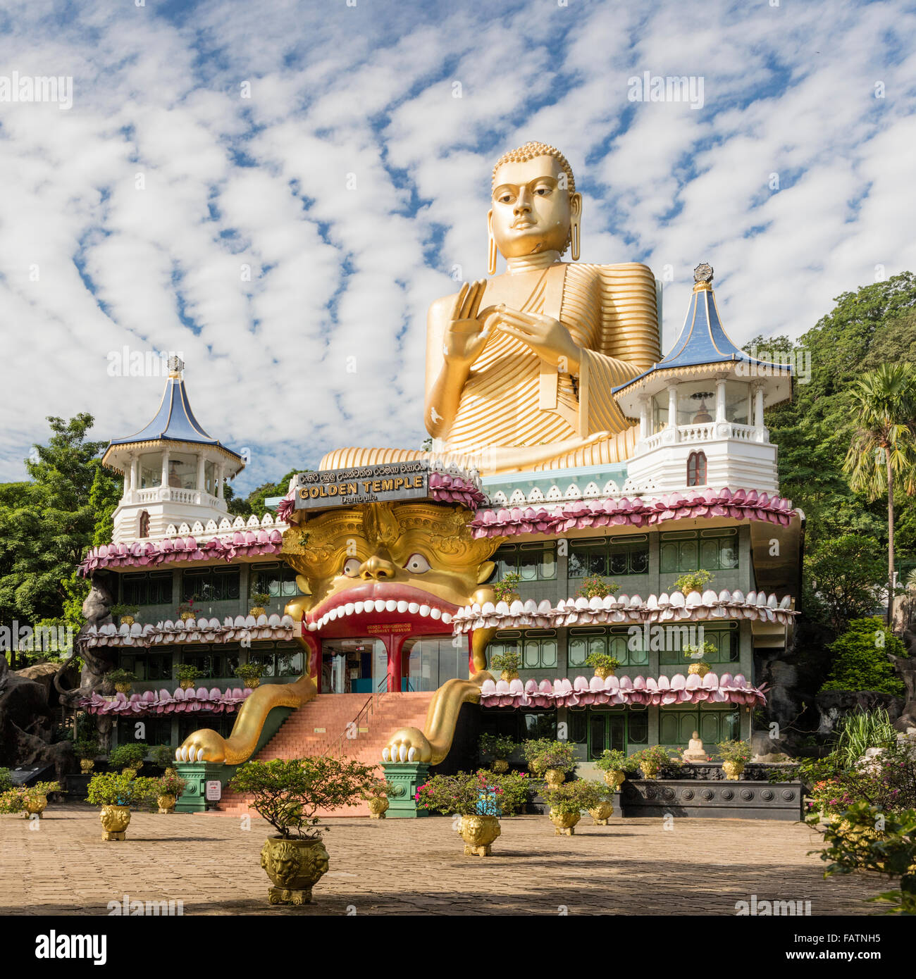 Colossal gilt seated Buddha statue at Golden Temple in Dambulla, Central Province, Sri Lanka Stock Photo