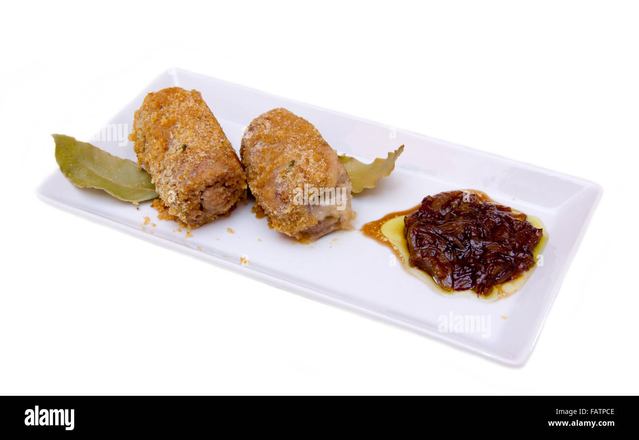 Breaded meat rolls on the tray on white background Stock Photo