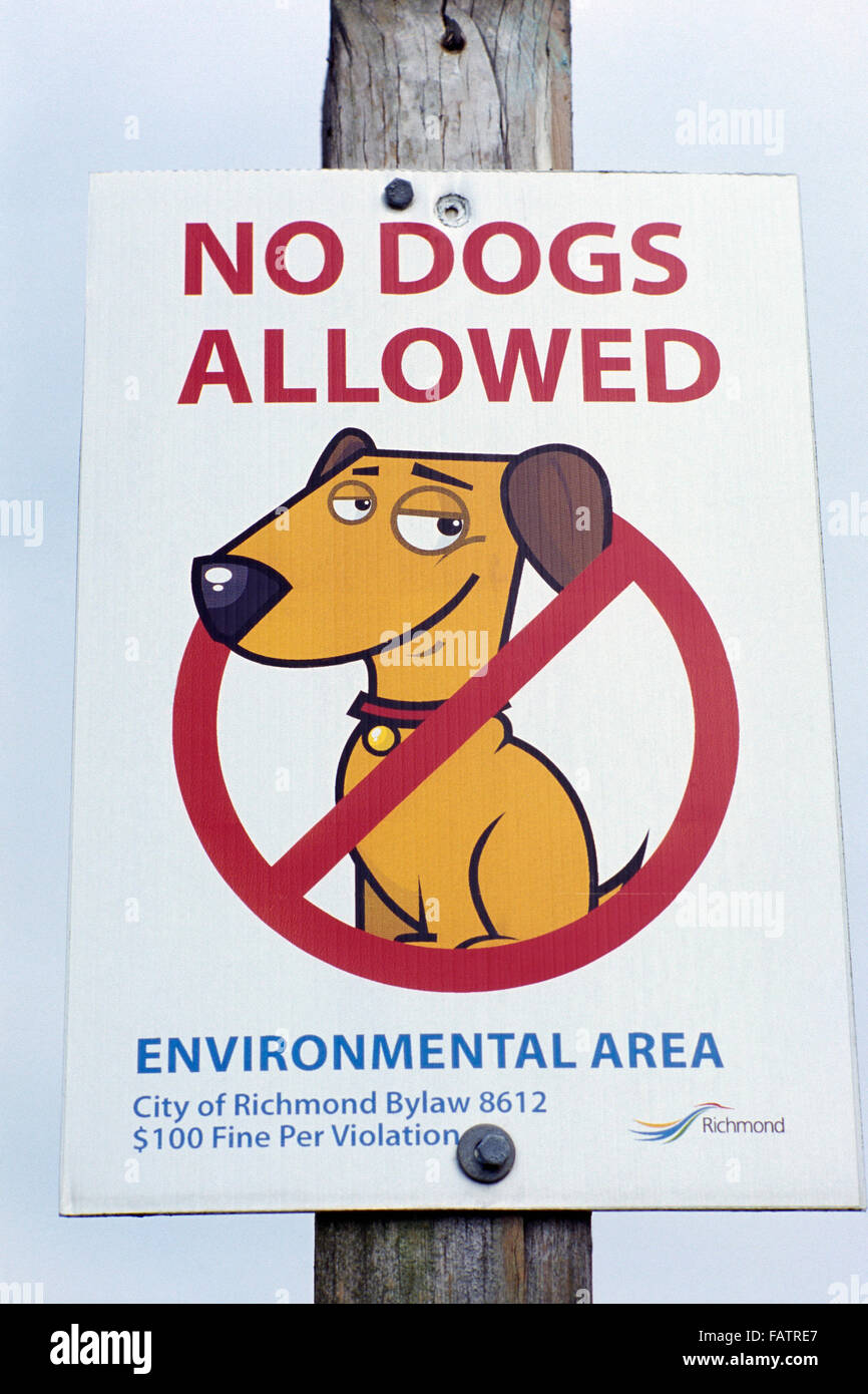 Funny Humorous / Humourous Sign advising No Dogs Allowed in Environmental Area Stock Photo