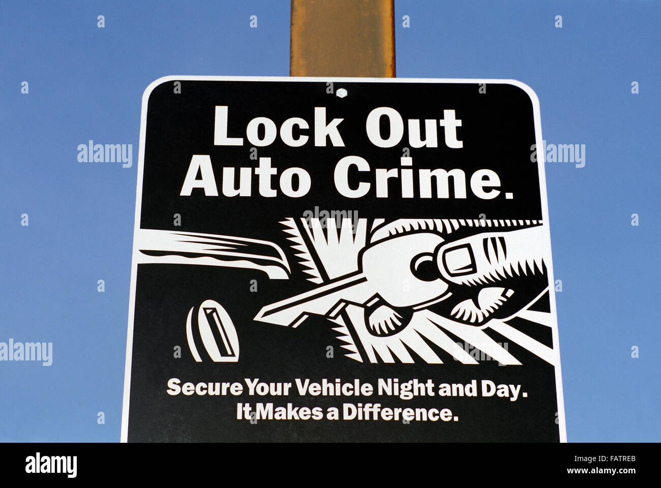 Warning Sign - Lock Out Auto Crime, Secure Your Vehicle / Car, Crime Prevention and Security, Public Notice Stock Photo