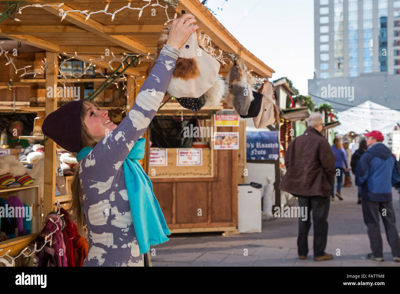 Denver, Colorado A shopkeeper hangs up merchandise at the Denver