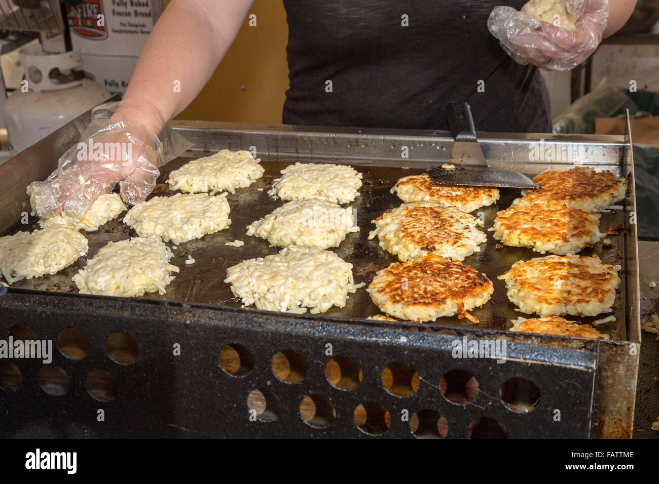 Denver, Colorado A vendor makes German potato pancakes at the Denver