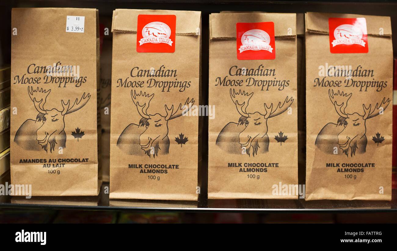 Bags of Canadian Moose Droppings (milk chocolate almonds) on airport store shelf, a product made in Canada Stock Photo