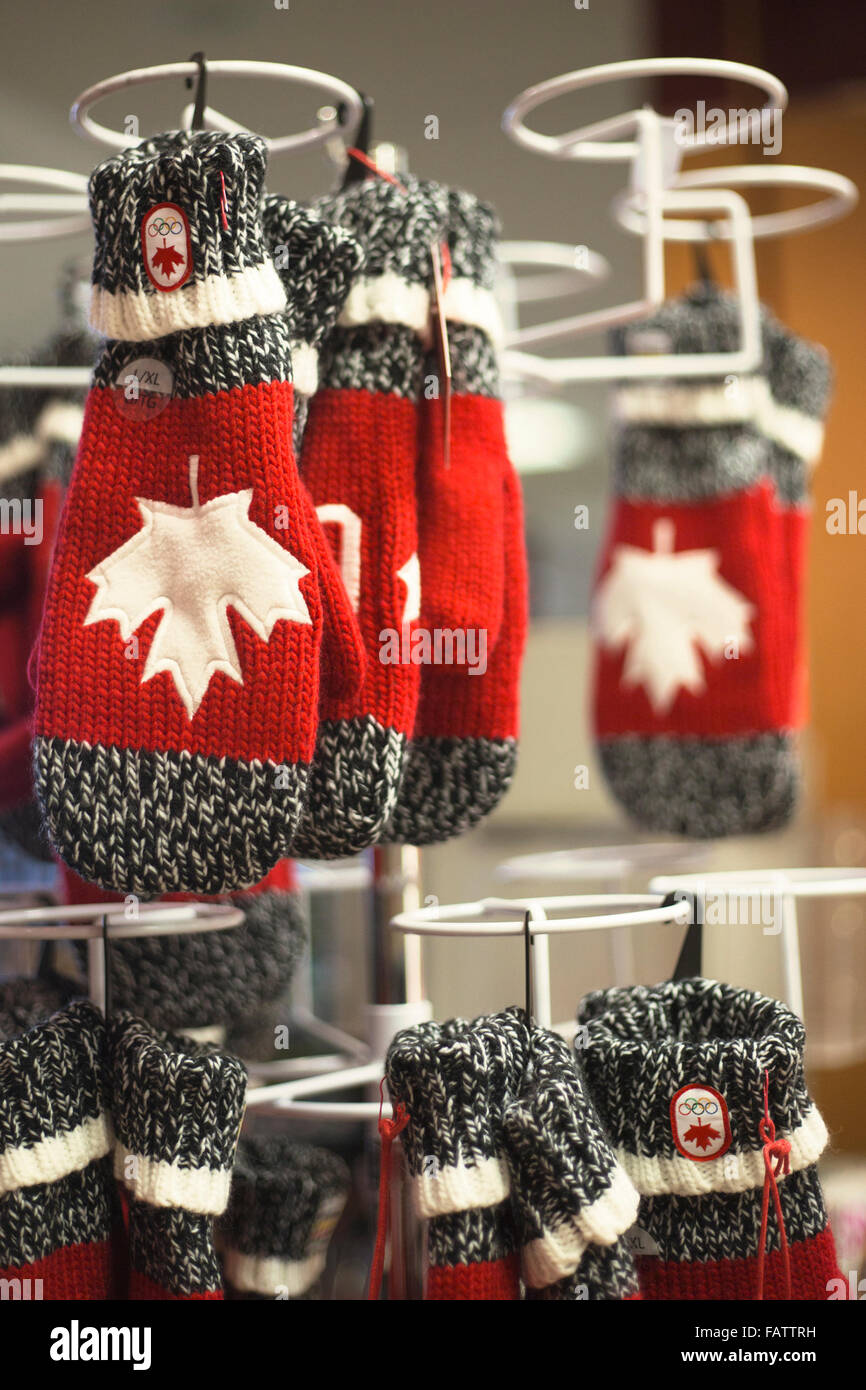 Mittens with Canadian maple leaf symbol and Olympic symbol in airport store Stock Photo
