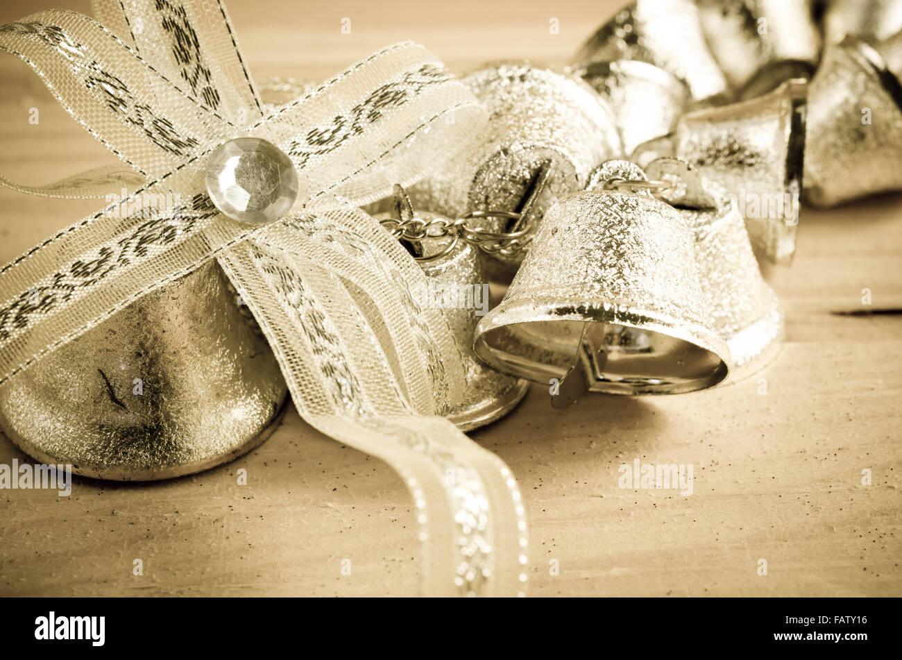 Christmas decoration. Silver bell in vintage background Stock Photo - Alamy