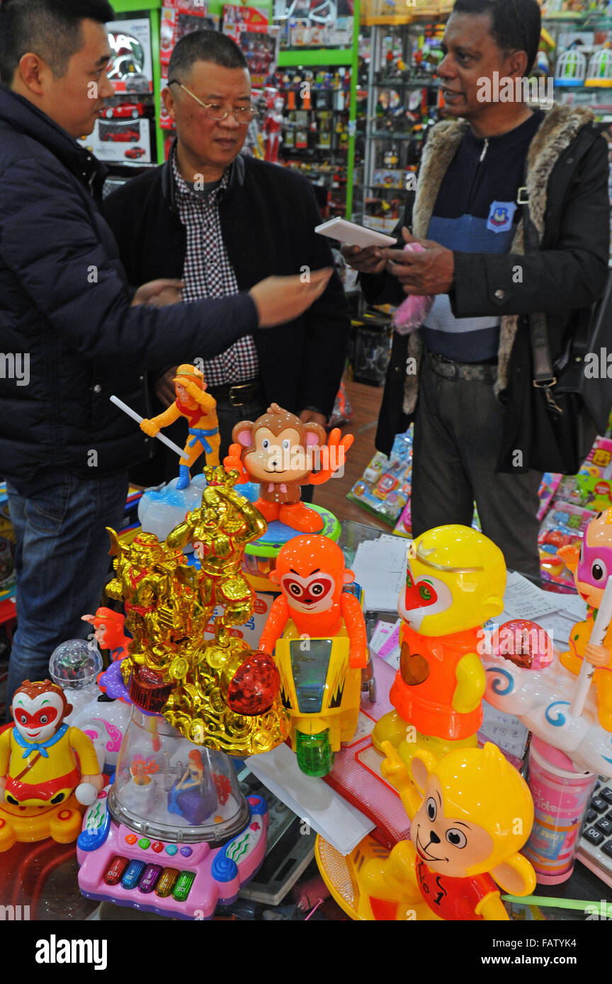 Yiwu, China's Zhejiang Province. 3rd Jan, 2016. An Indian trader (R) selects monkey-figure toys at Yiwu International Trading Mall, east China's Zhejiang Province, Jan. 3, 2016. The Chinese Year of Monkey will begin on Feb. 8 this year. Yiwu's wholesale markets are busy in the selling season for Chinese Spring Festival. © Tan Jin/Xinhua/Alamy Live News Stock Photo