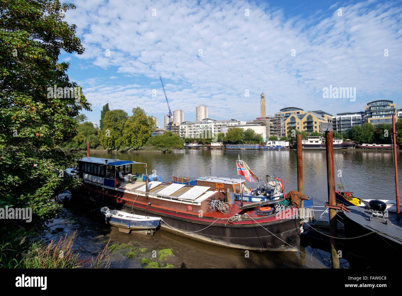 Houseboats moored on the river Thames near Kew Bridge, London, England, UK Stock Photo