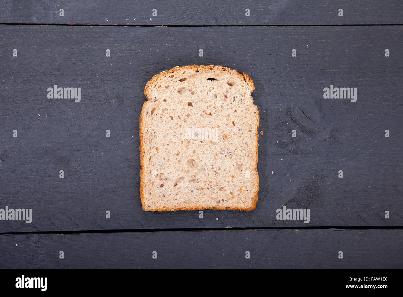 Gluten free bread on black wooden background Stock Photo