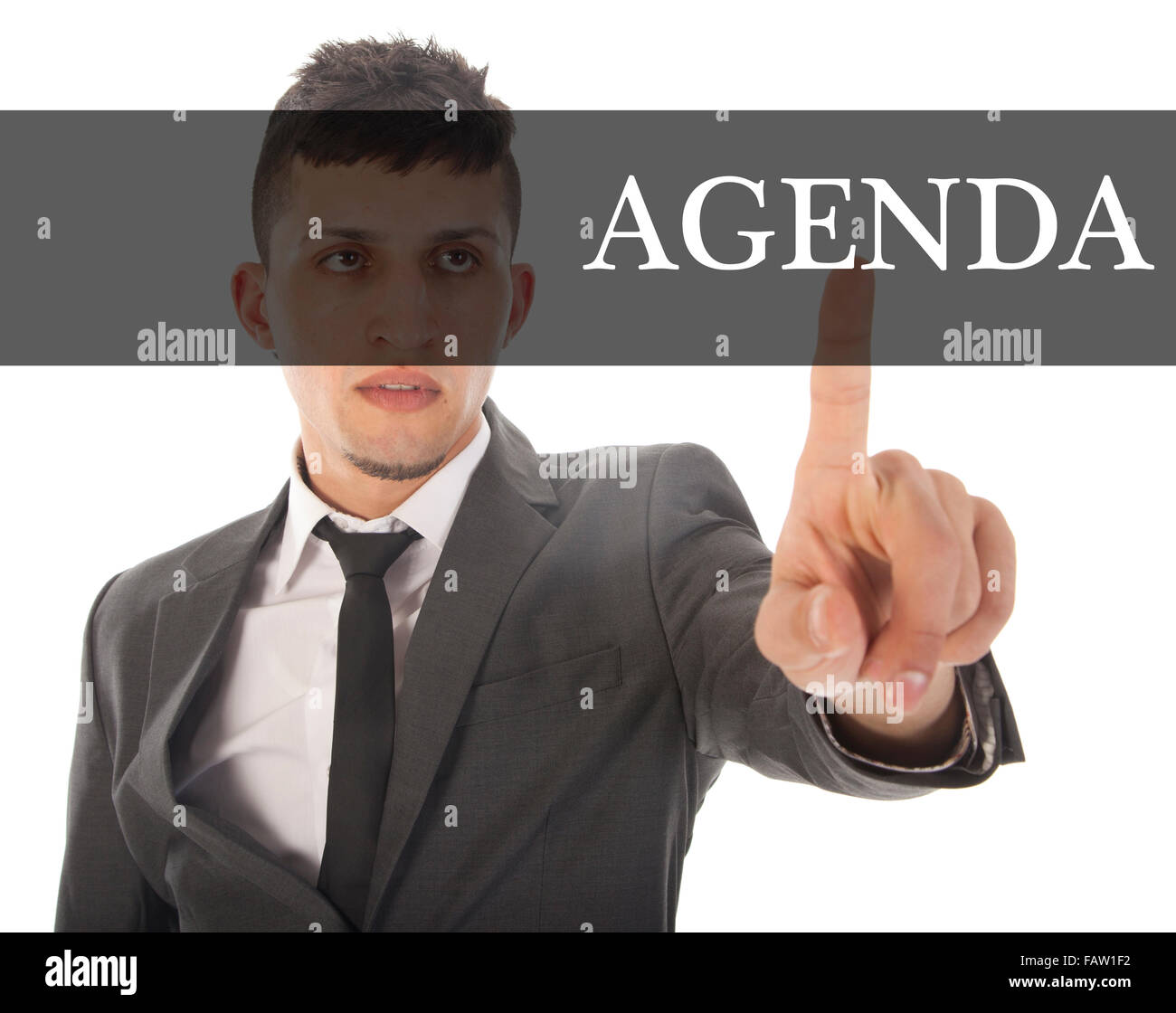 Young businessman with text agenda isolated on white background Stock Photo