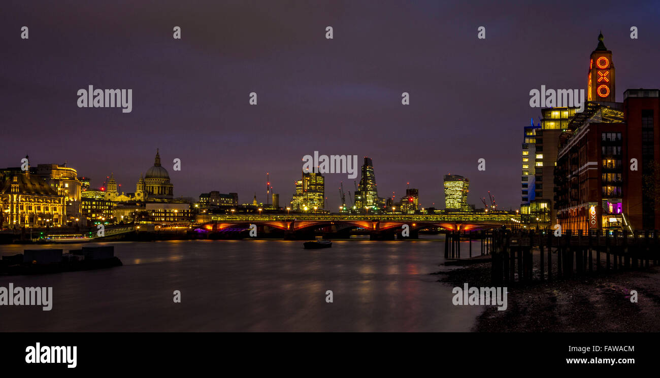 St Paul's Cathedral, Blackfriars Bridge, River Thames, and London skyline at dusk. Stock Photo