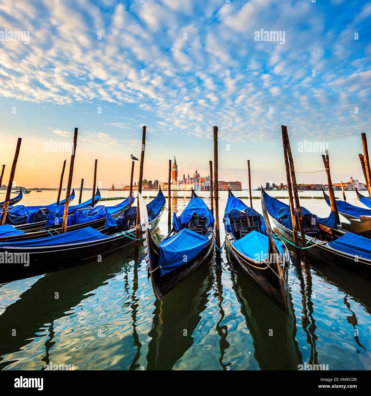 Gondolas in lagoon of Venice on sunrise, Italy Stock Photo - Alamy