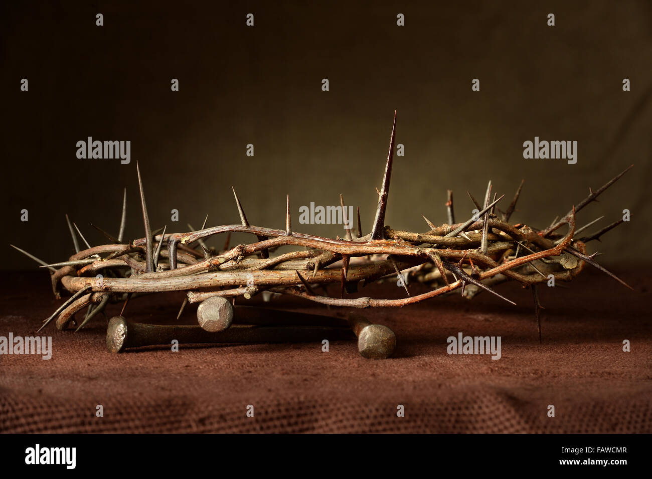 Nails and crown of thorns on cloth Stock Photo - Alamy