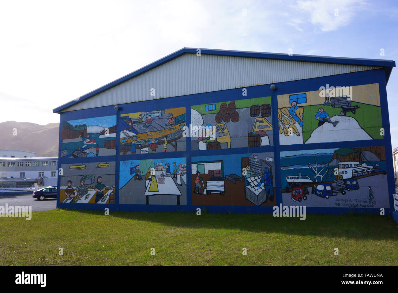 Mural of local trades on building in town Heimaey, Westman islands, Iceland Stock Photo