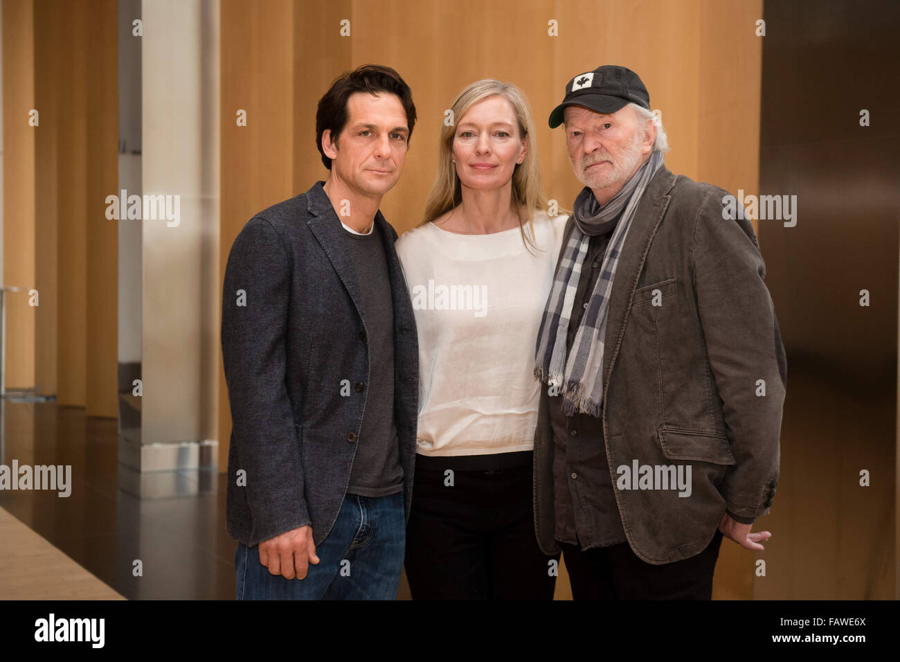 Actors Robert Seeliger (l-r), Katja Weitzenboeck and Michael Gwisdek posing for a photograp after a screening of the TV film Unser Traum von Kanada (lit. Our Dream of Canada) at the Canadian embassy in Berlin, Germany, 5 Janaury 2016. PHOTO: GREGOR FISCHER/DPA Stock Photo