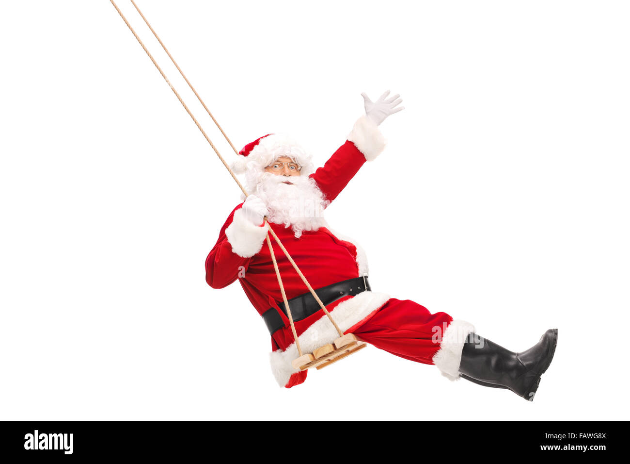 Full length profile shot of Santa Claus swinging on a wooden swing isolated  on white background Stock Photo - Alamy