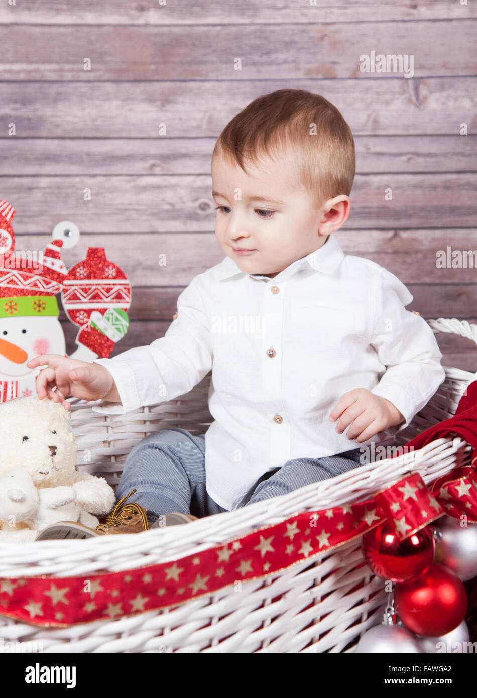 Portrait of 1 year old baby boy, Christmas theme, studio shot. Stock Photo