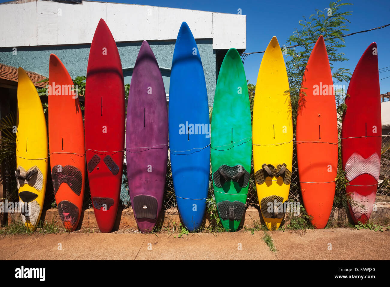 Old windsurf boards in a row as a fence; Paia, Maui, Hawaii, United States of America Stock Photo