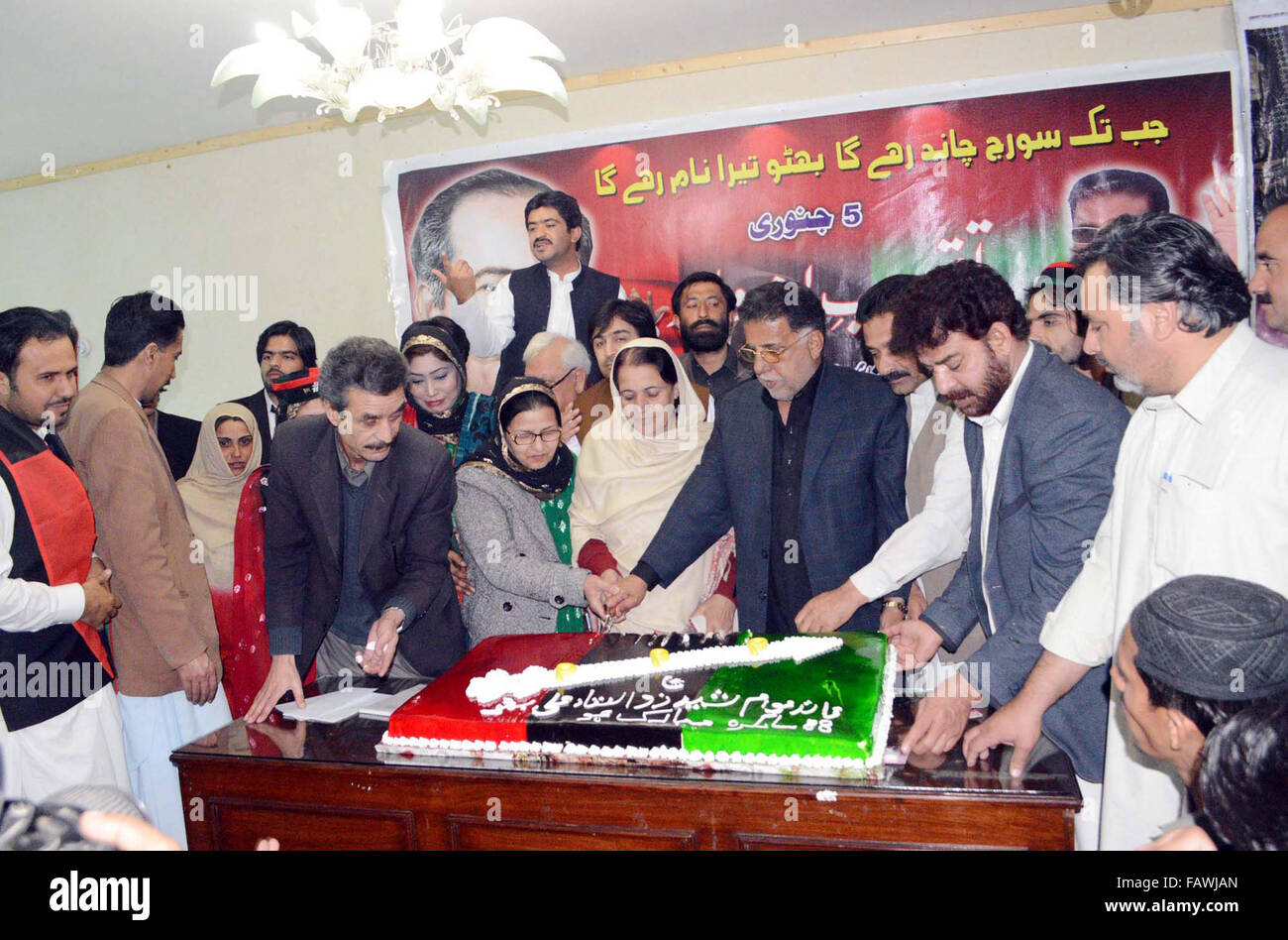 Leaders and activists of Peoples Party (PPP) cut cake on the occasion of 88th Birthday Day Anniversary of PPP Leader, Late Zulfiqar Ali Bhutto, during a ceremony held in Quetta on Tuesday, January 05, 2016. Stock Photo
