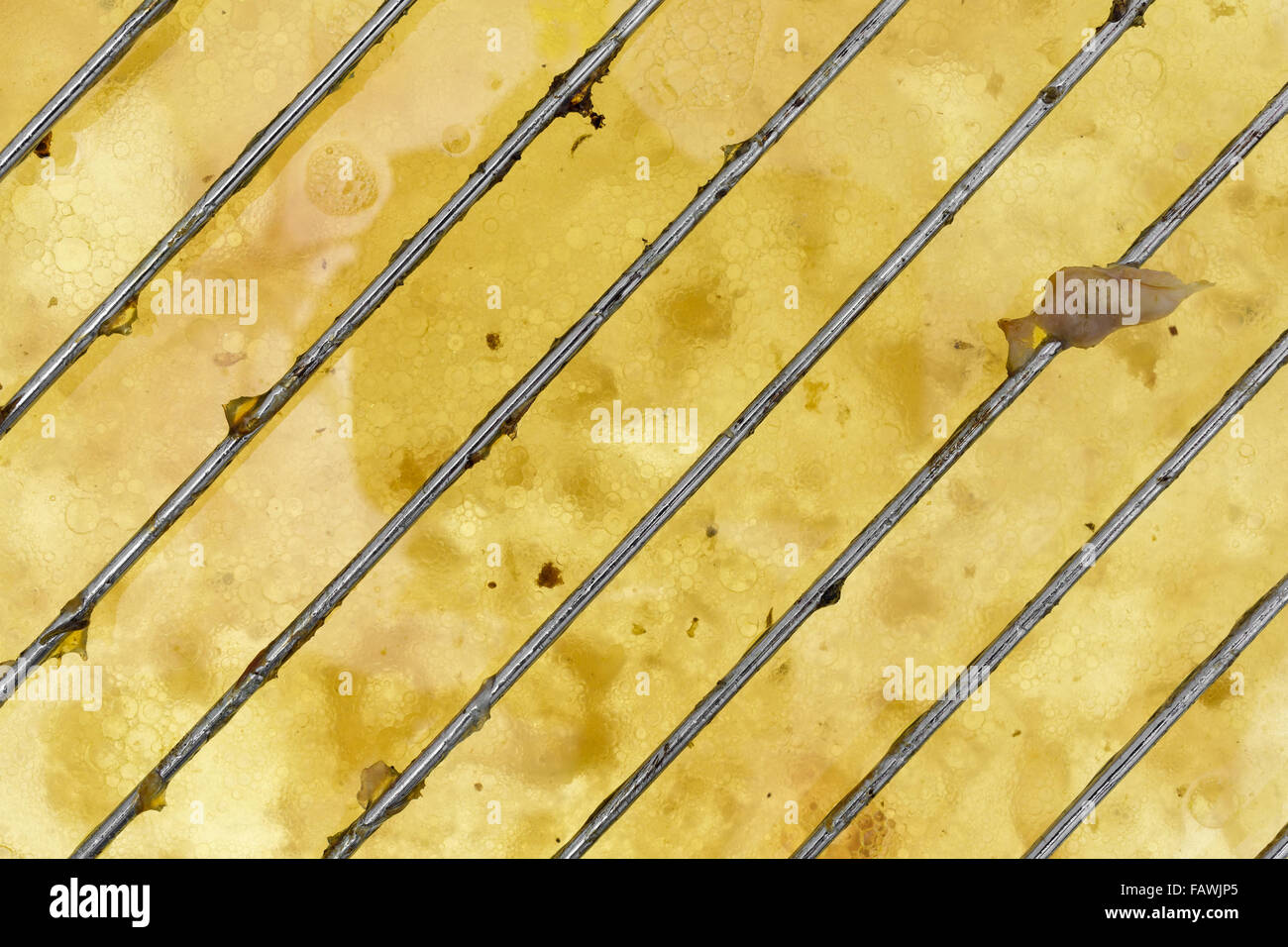 A wire rack that was used for cooking chicken with the grease and fat