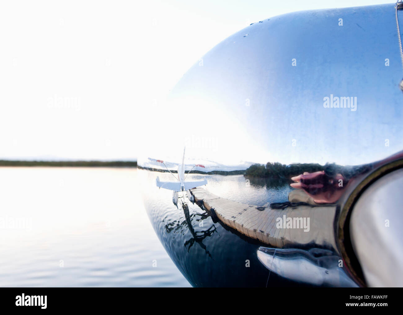 Reflection in nose cone of floatplane; Alaska, United States of America Stock Photo