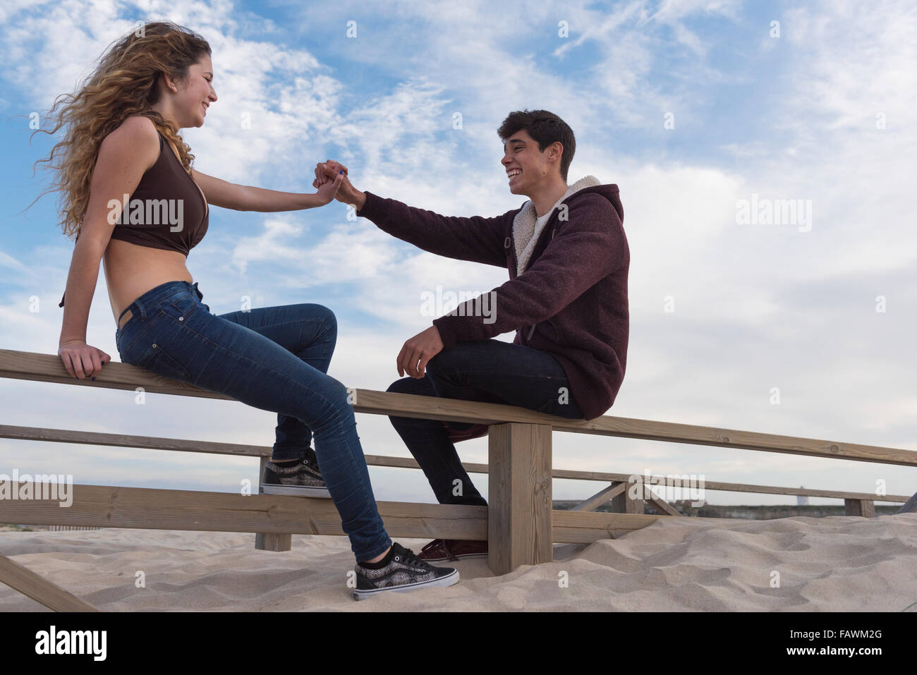 Teenage girl sitting wooden fence hires stock photography and images