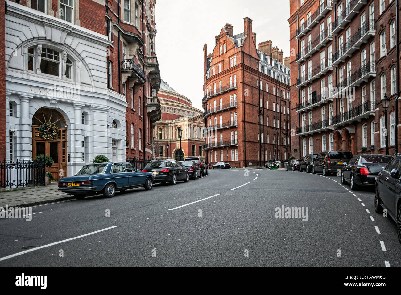 Brick row houses at Kensington Gore Street with Royal Albert Hall in the back, Kensington, London. Stock Photo