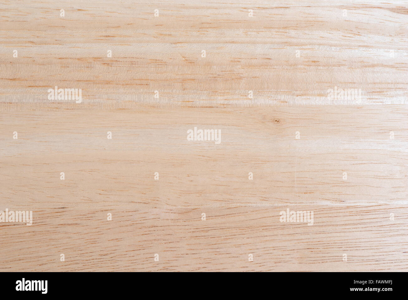 A clean wood glued table top illuminated with natural light. Stock Photo
