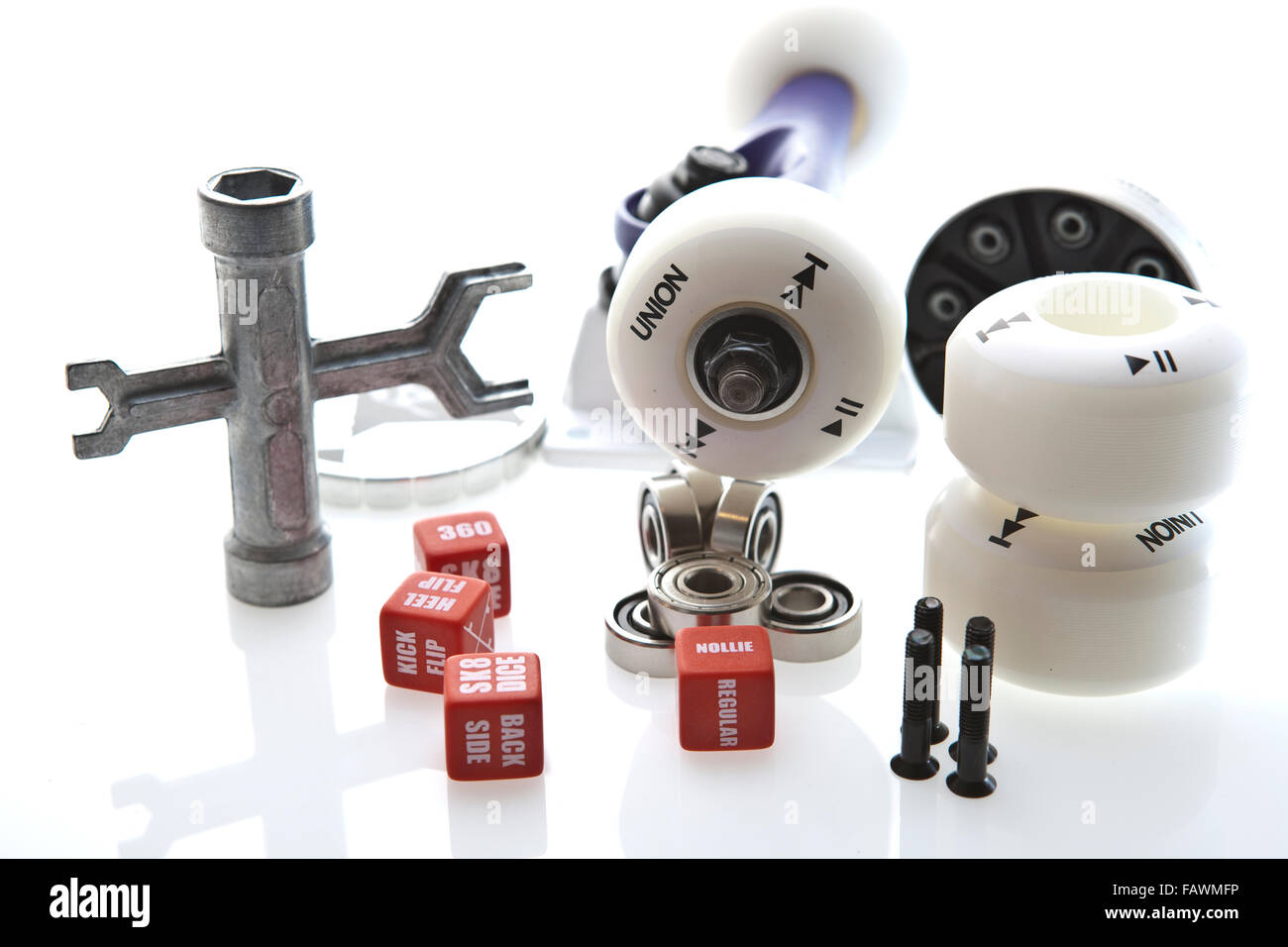 Skate Board Wheels Wrench bolts and bearings on a background Stock