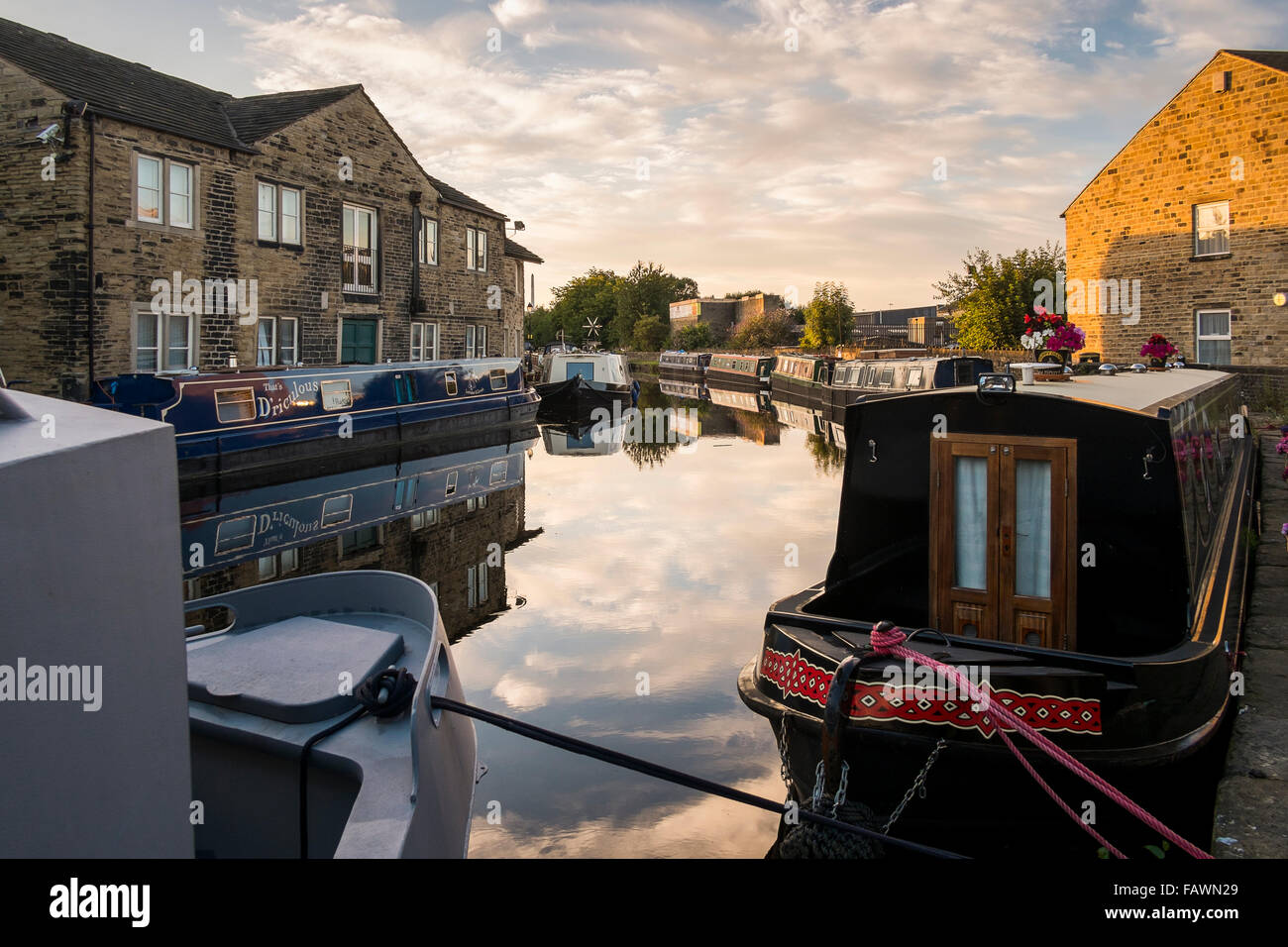 Barges at Apsley Basin on the Broad Canal in Huddersfield on a summer's evening. Stock Photo