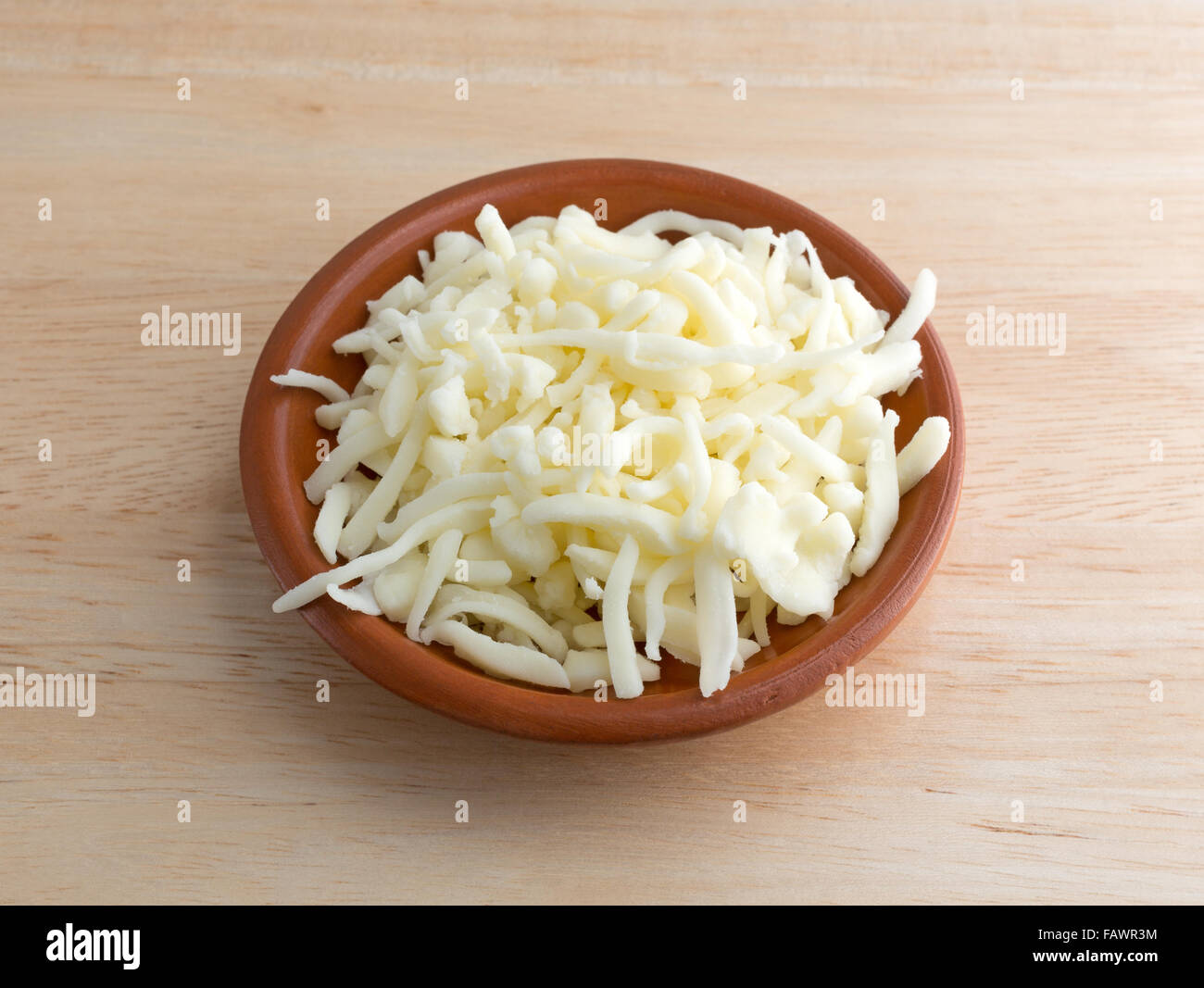 A portion of low moisture whole milk mozzarella pizza cheese in a small