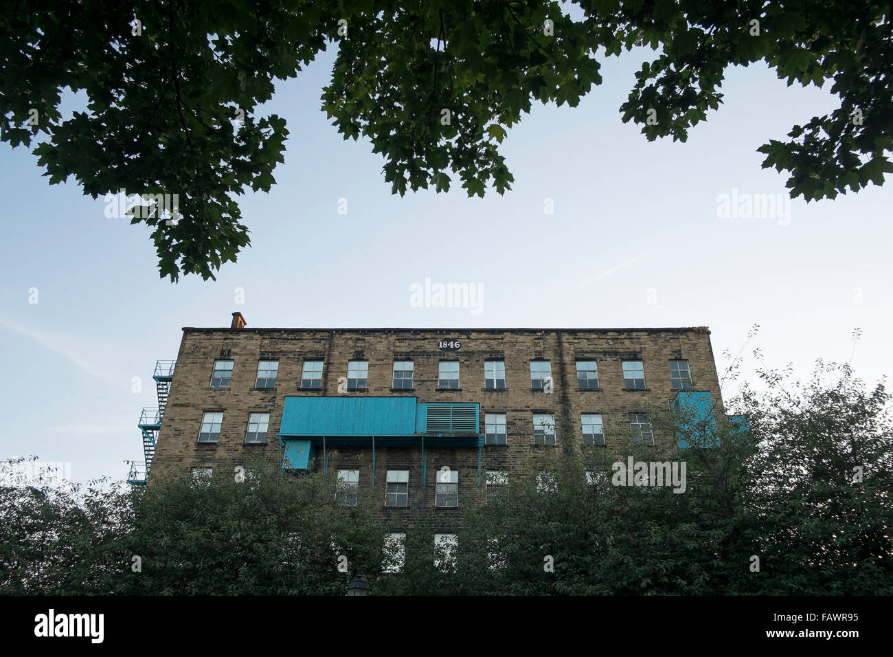 Old mill building viewed from the Broad Canal in Huddersfield. Stock Photo