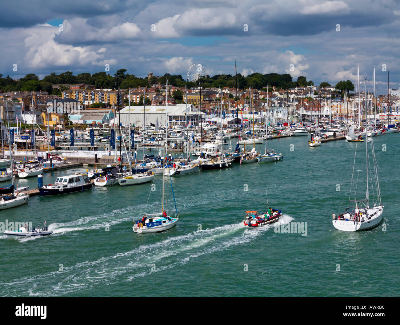 Sailing boats and the harbour at Cowes during Cowes Week a regatta held every August on the Isle of Wight southern England UK Stock Photo