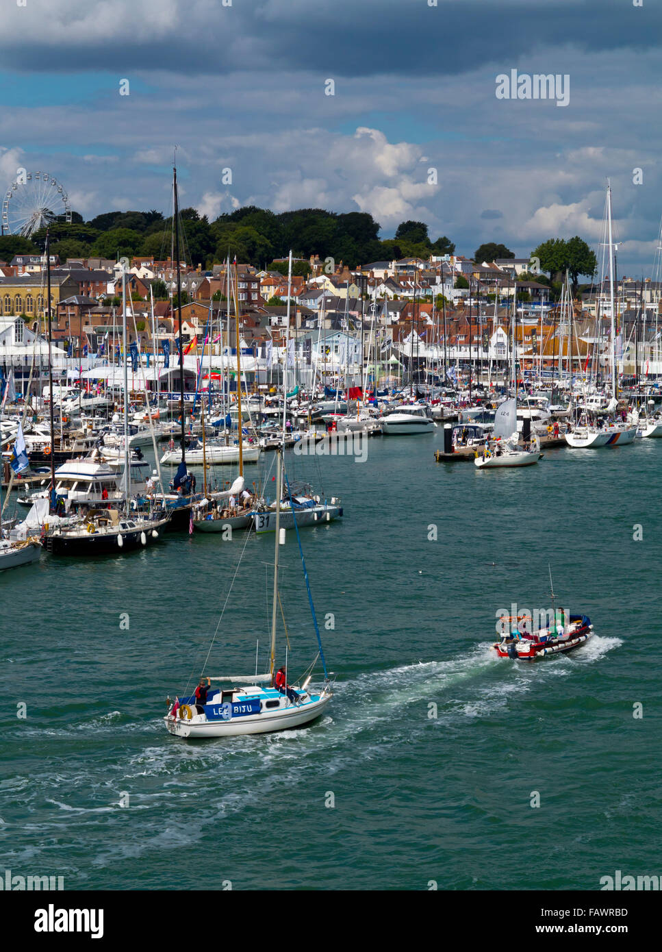Sailing boats and the harbour at Cowes during Cowes Week a regatta held every August on the Isle of Wight southern England UK Stock Photo
