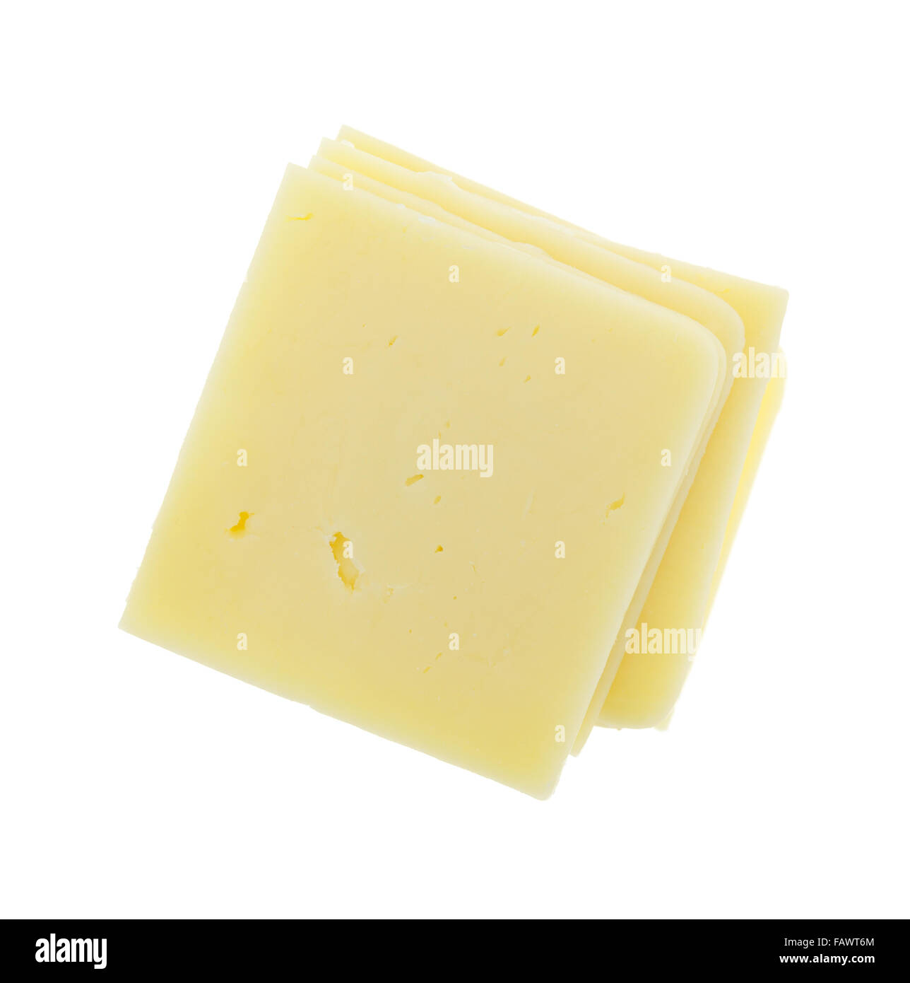 Top view of a stack of square cheddar cheese slices isolated on a white background. Stock Photo