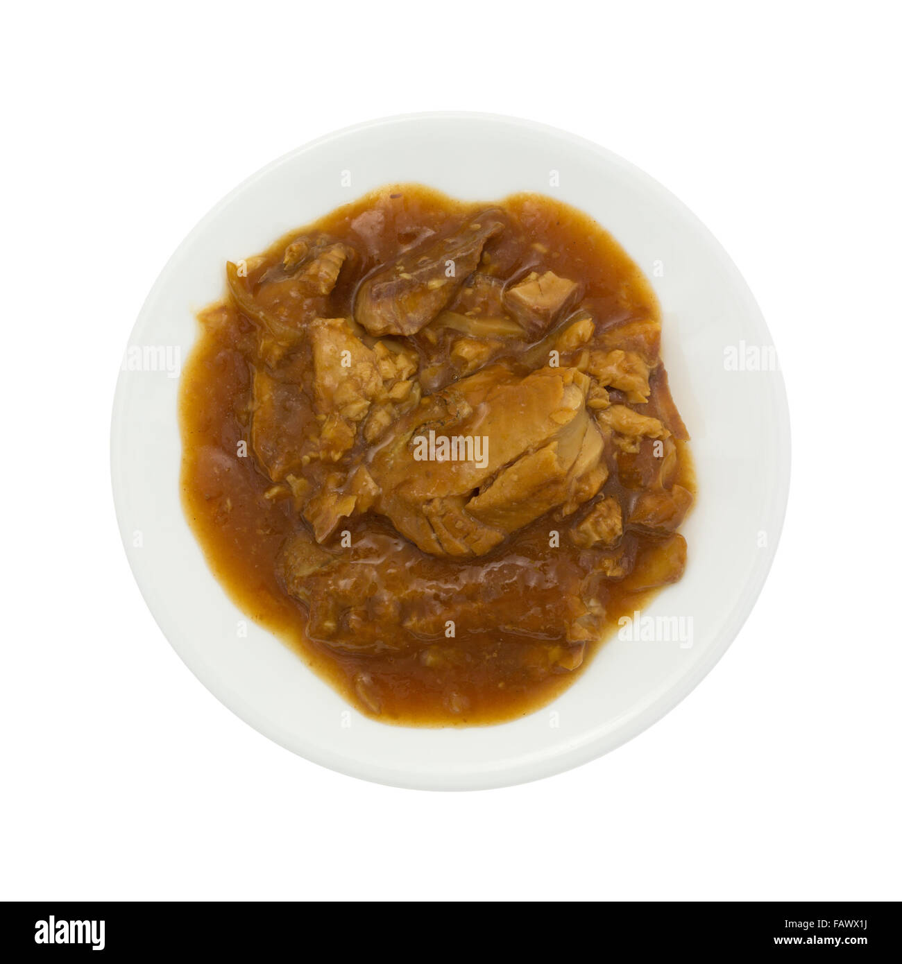 Top view of tilapia fillets in a thick teriyaki sauce on a plate isolated on a white background. Stock Photo
