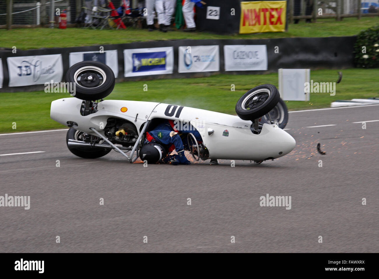 Cooper Norton Mk8 skidding along start finish straight, upside down at Goodwood Revival meeting 2015. Earl of March Trophy. Stock Photo