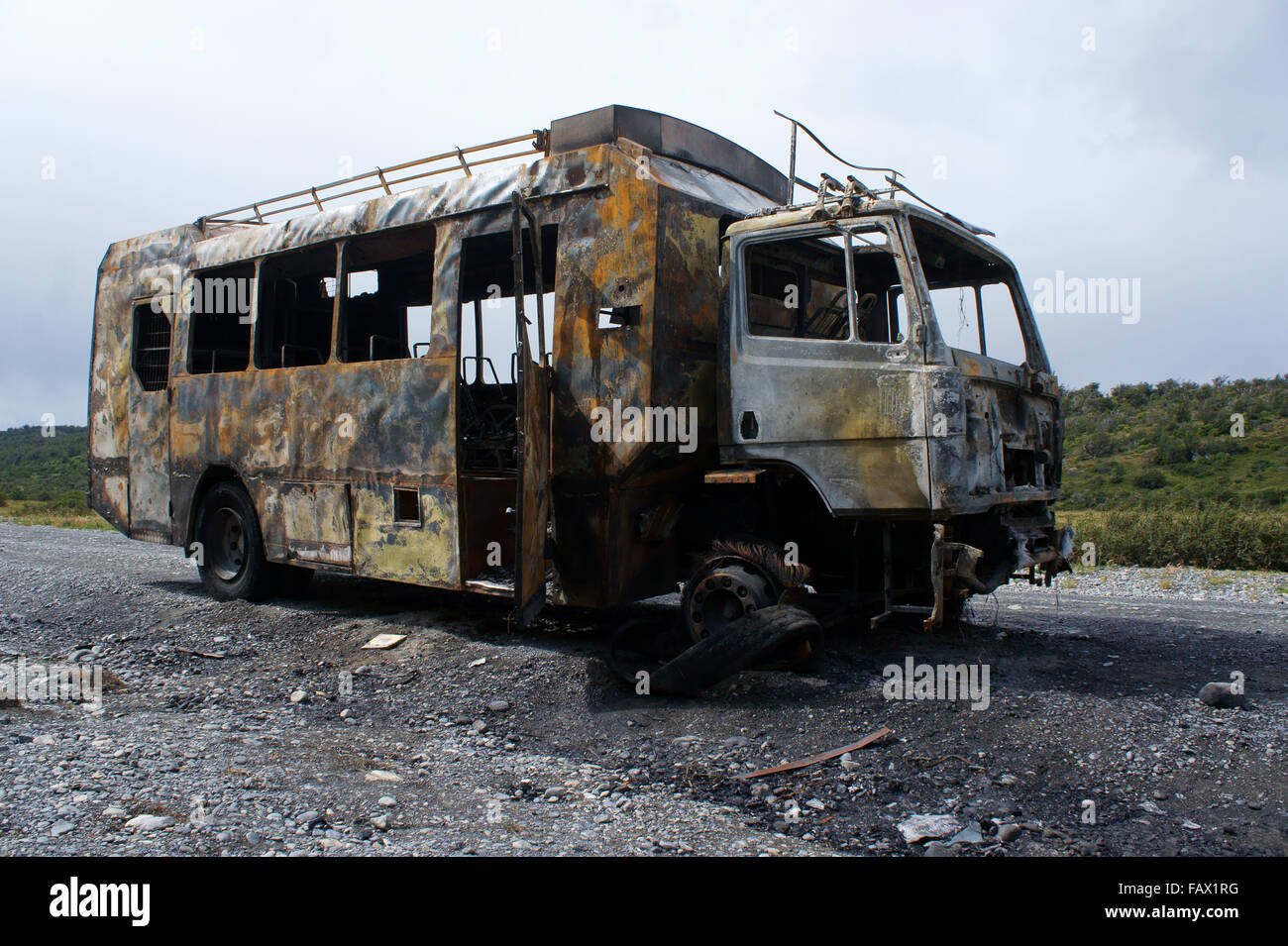 Burned tour bus on road to Lago Grey, Torres del Paine National park, Patagonia, Chile Stock Photo
