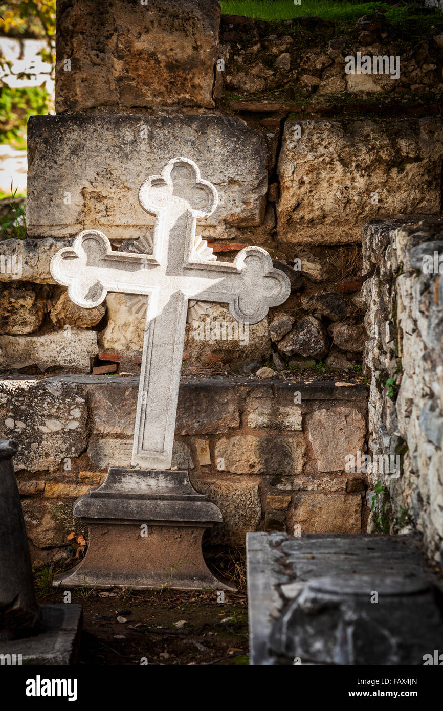 White cross and stone wall, Church of the holy apostles; Athens, Greece ...