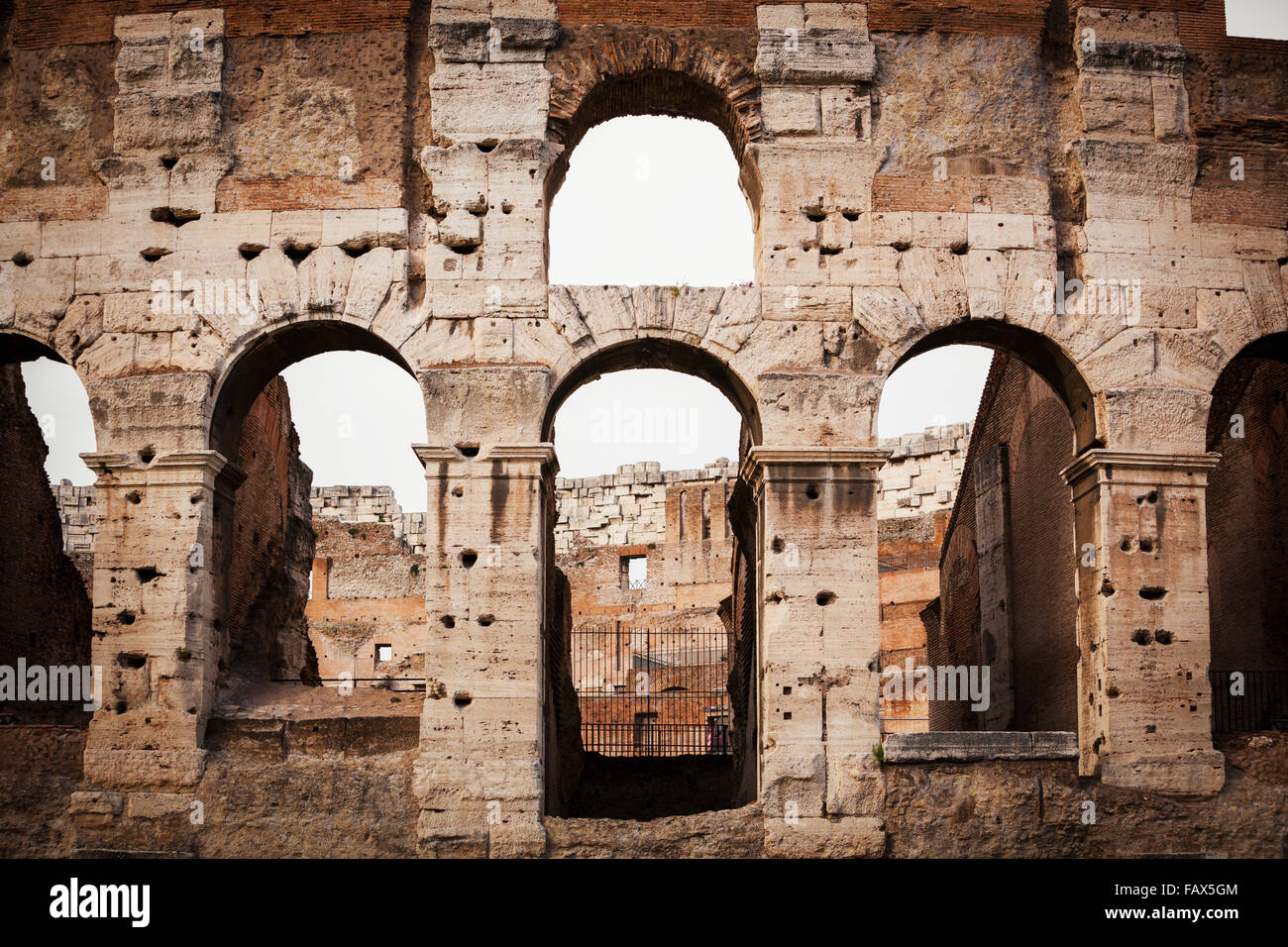 Old stone wall of Colosseum with arches; Rome, Italy Stock Photo - Alamy