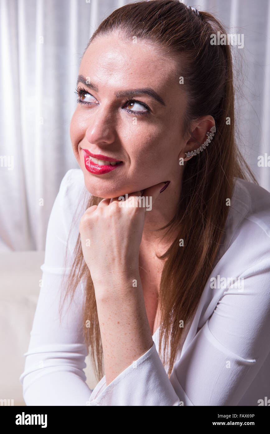 portrait of a beautiful woman smiling into the light Stock Photo