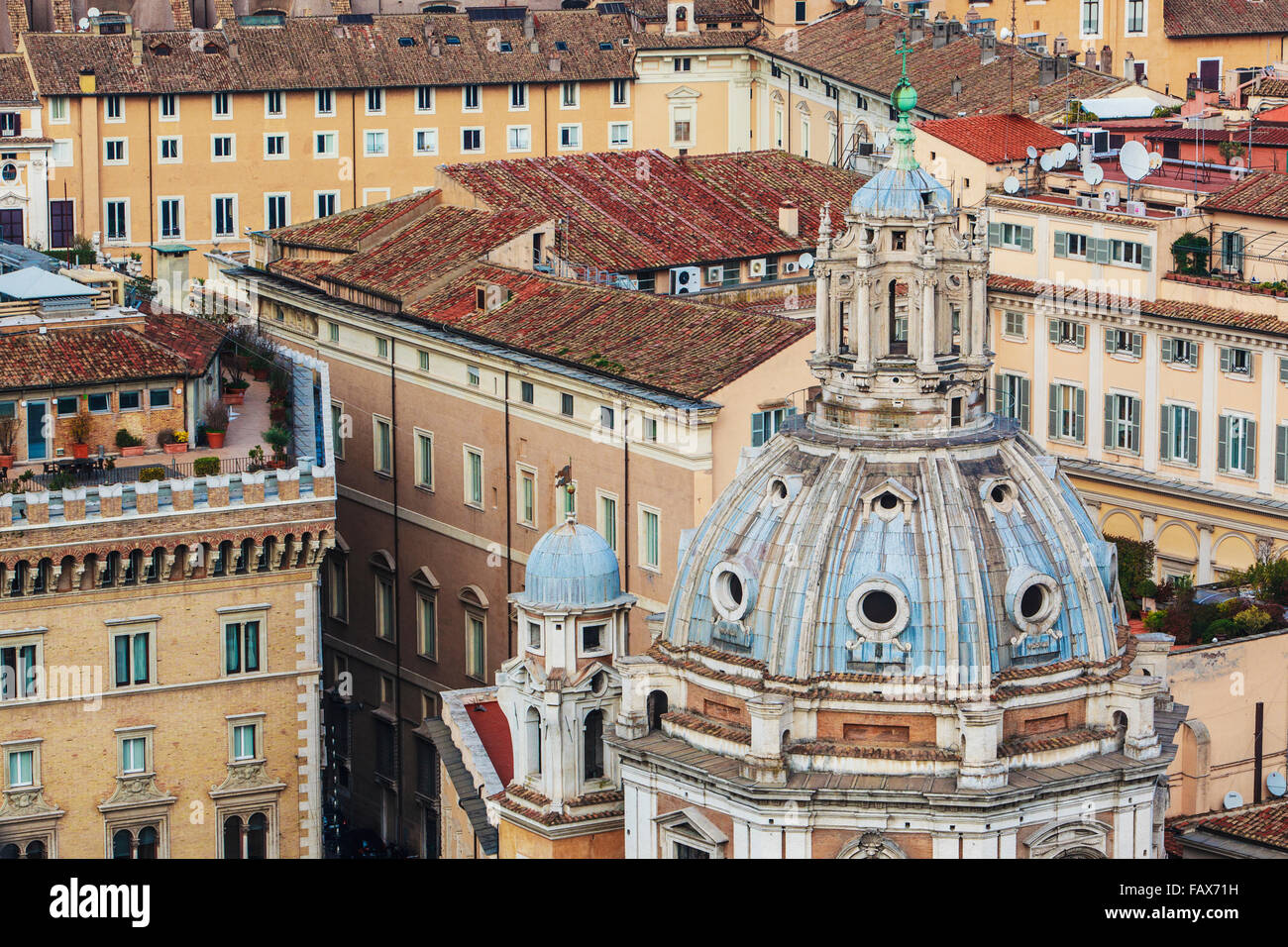 Dome of church roof with cross and various other buildings; Rome, Italy ...