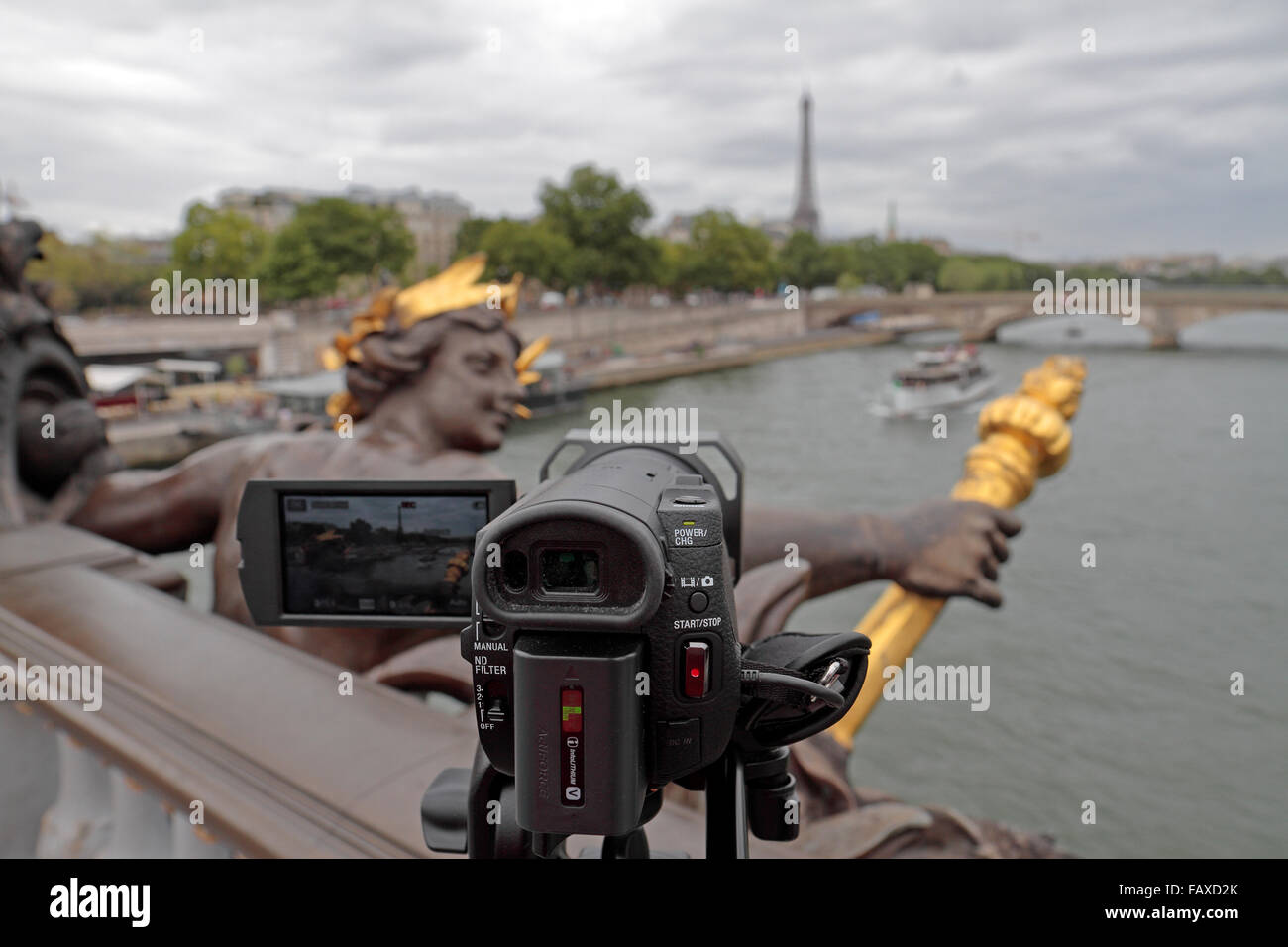 View past a 4k video camera on a tripod looking along the River Seine in Paris, France. Stock Photo