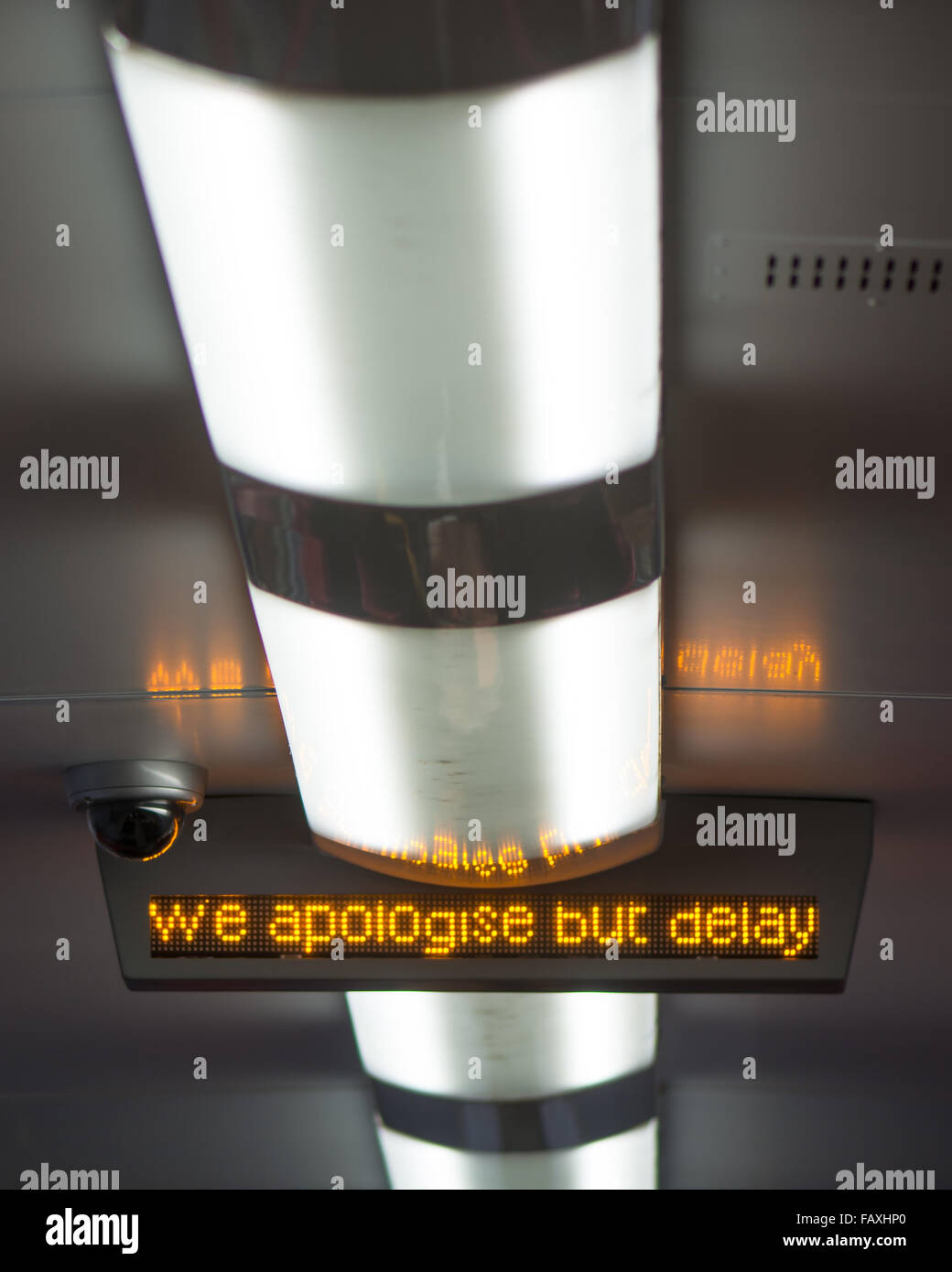 Railway apology and delay announcement 'We Apologise but delay'. Frozen at a point that amusingly summarizes the message Stock Photo