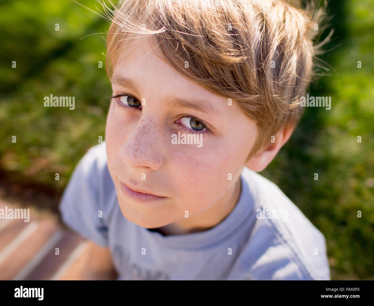 Close up portrait of 12 year old boy in sunshine Stock Photo