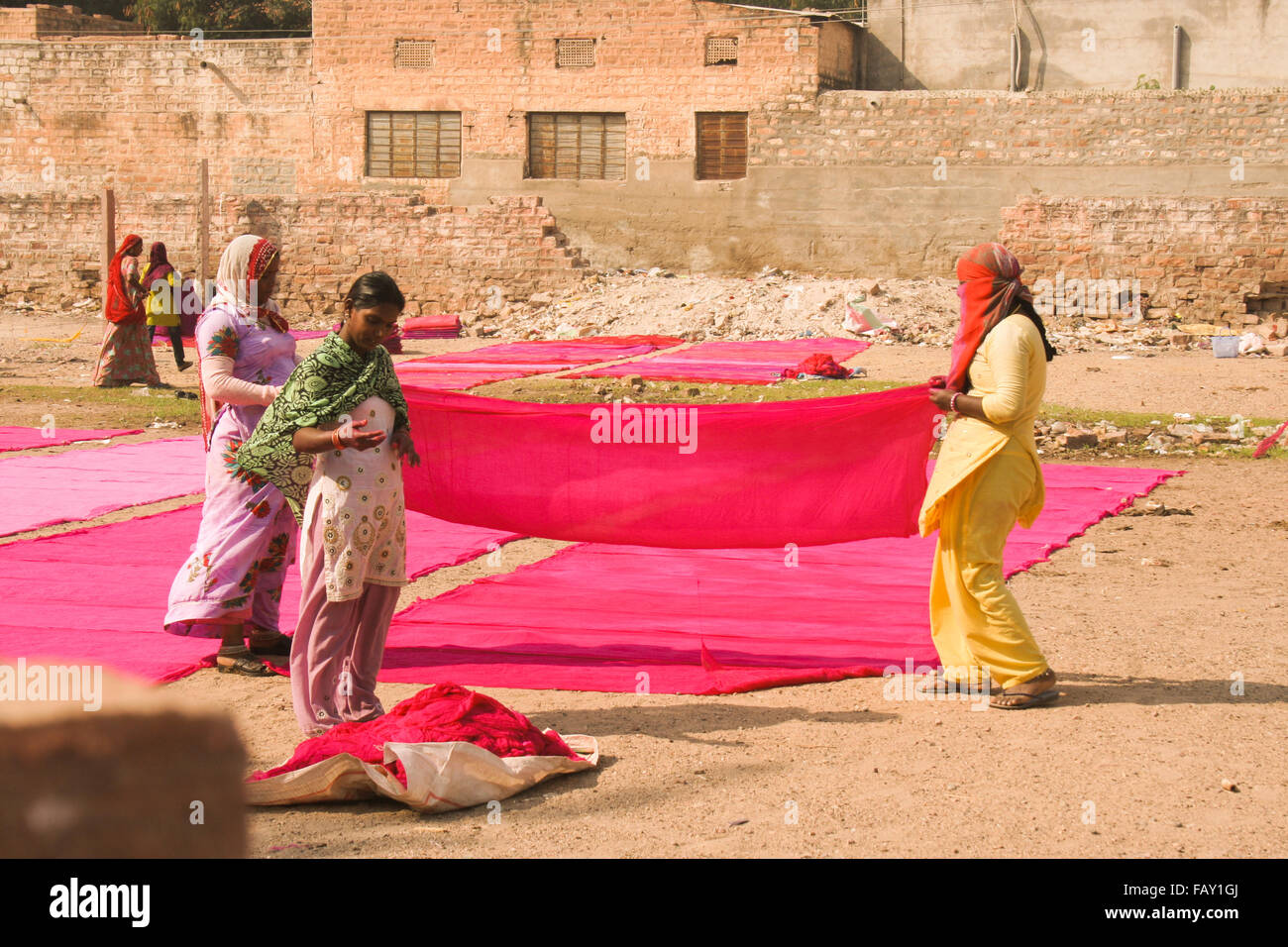 30th November 2015, Jodhpur, Rajastan, India. Traditional process of dyeing pink ad red cloth. Stock Photo