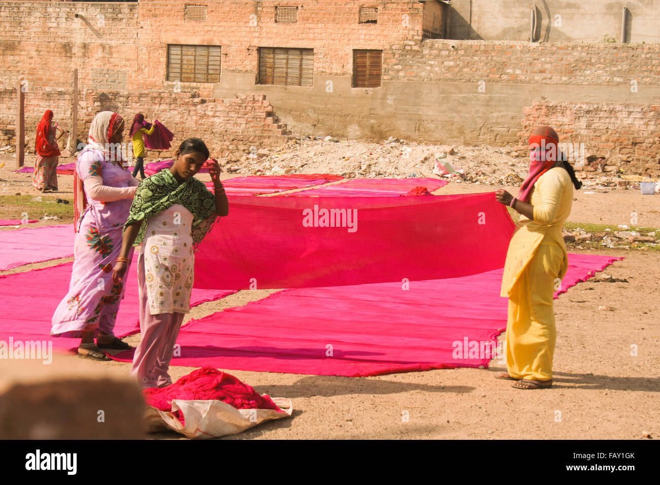 30th November 2015, Jodhpur, Rajastan, India. Traditional process of dyeing pink ad red cloth. Stock Photo
